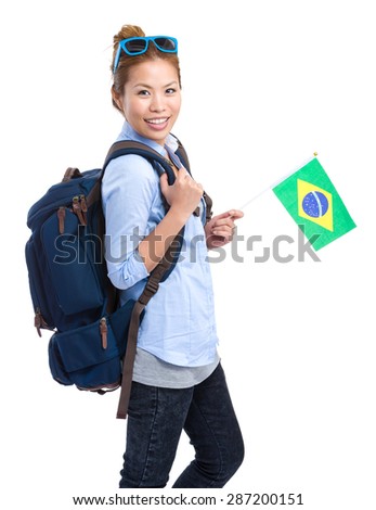 Young woman holding a small brazil flag