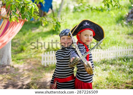 children play pirates outdoors
