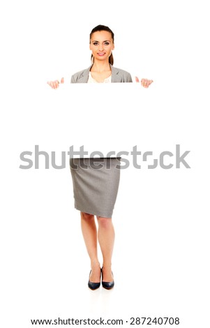 Beautiful business woman presenting empty banner.