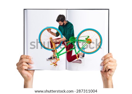 Man fixing printed on book