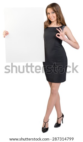 Business woman holding a large blank billboard and shows sign ok.