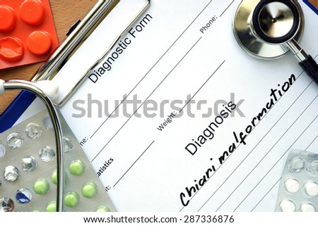 Diagnostic form with diagnosis Chiari malformation and pills. Royalty-Free Stock Photo #287336876