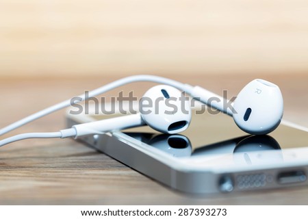 headphones and phone depth of field Royalty-Free Stock Photo #287393273