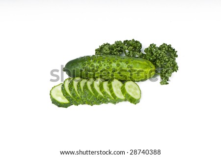 Cutted cucumbers and parsley, healthy food isolated on white