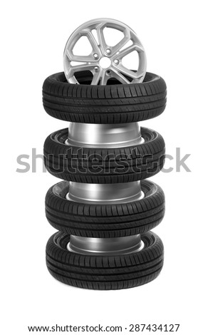 A stack of car wheels and tires. Isolate on white.