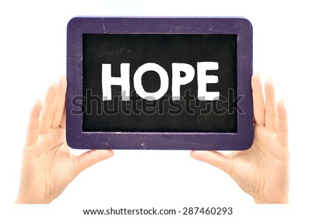 Hands holding blackboard with hope