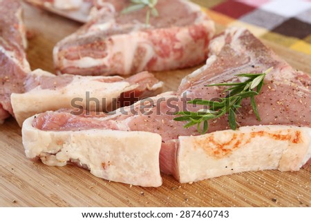 Raw meat on wood board