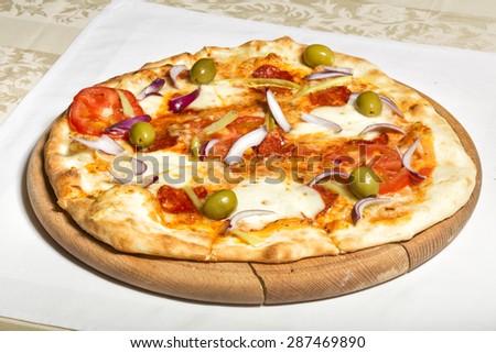 Pizza on wooden board