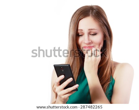 Young elegant woman talking on mobile phone against white background