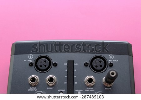 Audio interface for recording or mixing - sound/audio card - music making on pink background