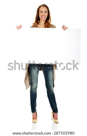 Beautiful happy woman with blank board.