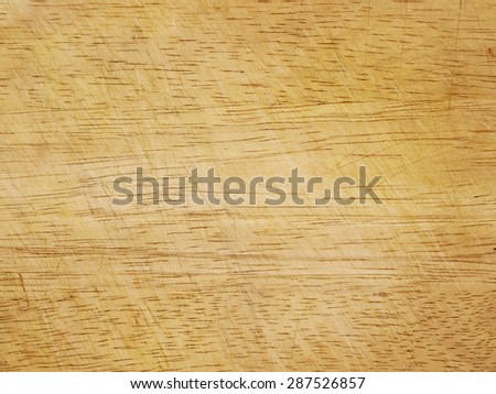 closeup of a worn wooden cutting board