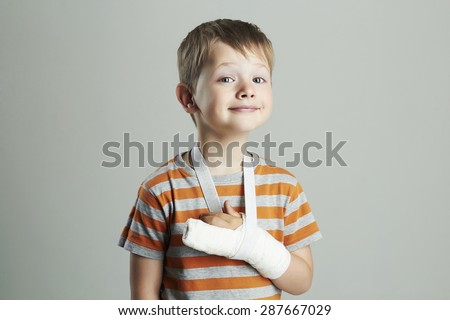 little boy in a cast.child with a broken arm. funny kid after accident. Royalty-Free Stock Photo #287667029