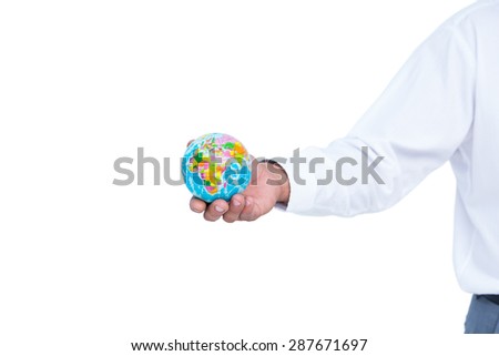 image of businessman holding earth against white screen
