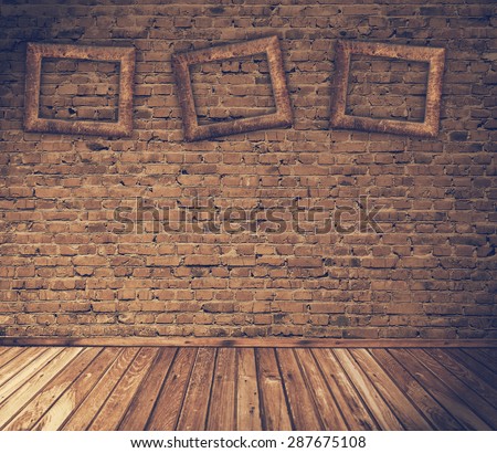 old grunge interior with blank photo frames against wall, retro filtered, instagram style