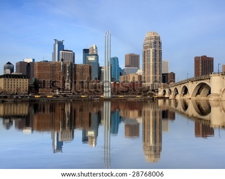 Reflection of downtown Minneapolis in Mississippi river without wires