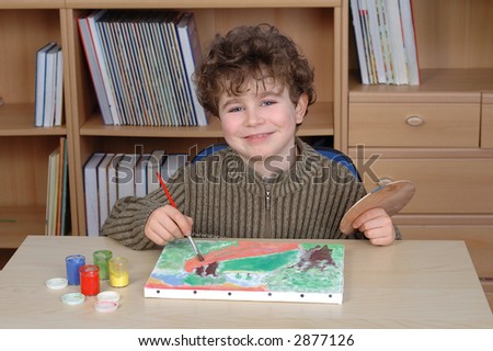 Young artist is painting a picture
