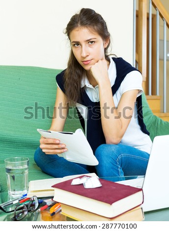 tired female college student study at home