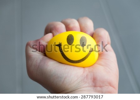 squeezing stress ball Royalty-Free Stock Photo #287793017