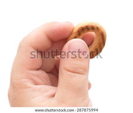 bagel in the children's hand on white