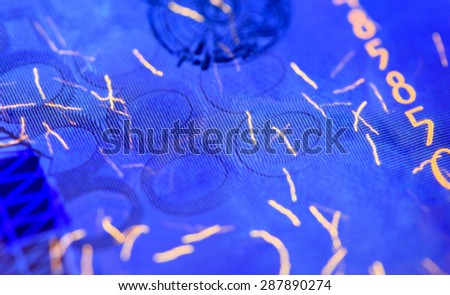 Security features on banknote in UV light protection, abstract background of money