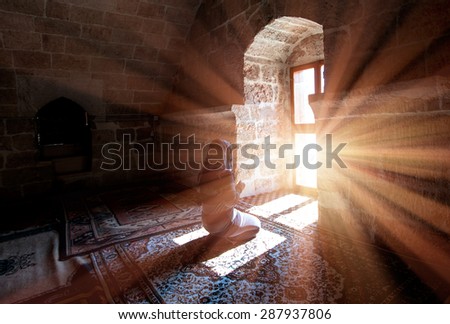 Young Muslim Woman Praying In Mosque Royalty-Free Stock Photo #287937806