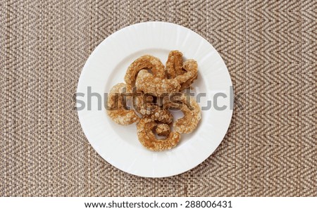 Thai style pork rind snack on placemats background