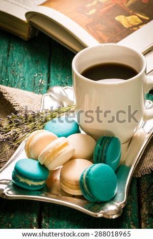 fresh macaroons on wooden table .Vintage filter 