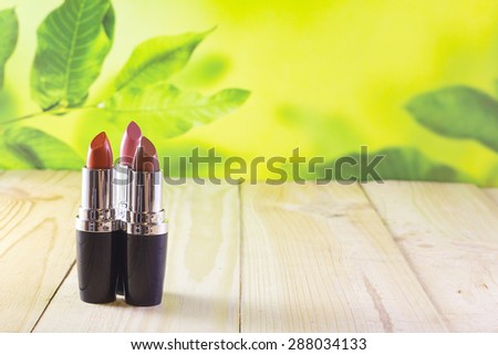 open lipstick on a board are among nature