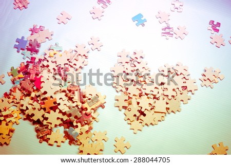 LOVE - Jigsaw puzzle in the shape of heart with icons that illustrate the love story and relations of a couple - Vintage retro picture style
