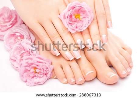 Relaxing pedicure and manicure with a pink rose flower Royalty-Free Stock Photo #288067313