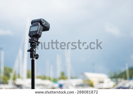 Flash on a tripod for photography, camera