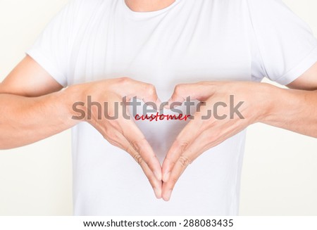 heart shape hands on left side chest of a man in white shirt with words - customer