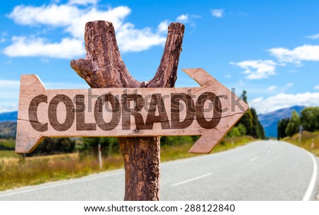Colorado wooden sign with road background