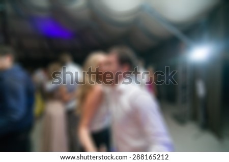 People dancing at the party abstract blur background with bokeh