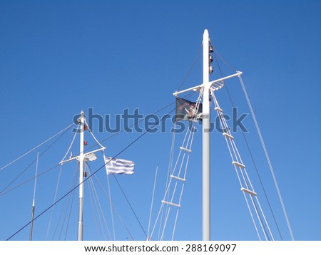 Masts of the yachts in the background of the blue sky