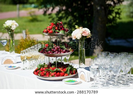 Dessert table with a large fruit composition