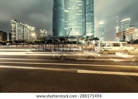 The light trails on the modern building background in shanghai china