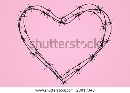Photo of big iron heart over pink background