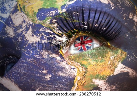 woman's  face with planet Earth texture and british flag inside the eye. Elements of this image furnished by NASA.