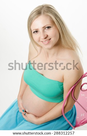 Young cute pregnant girl twenty five European-type