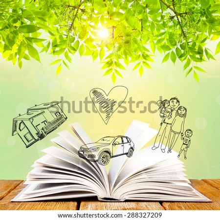 Open book with drawings on nature background