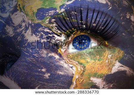 woman's face with planet Earth texture and european union flag inside the eye. Elements of this image furnished by NASA.