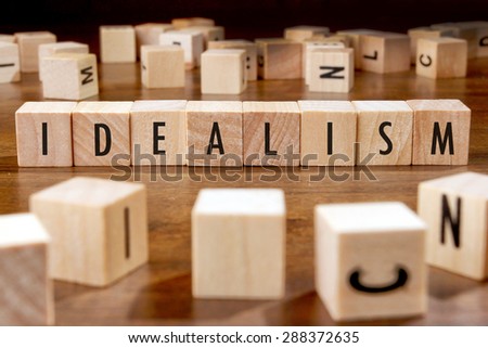 IDEALISM word written on wood block