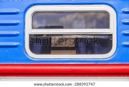 window of the old passenger car with red stripe