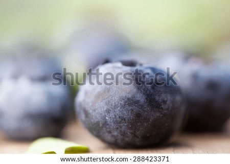 Blueberries on wooden table. Selective focus.