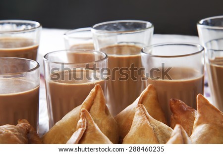 Close-up of samosas and tea