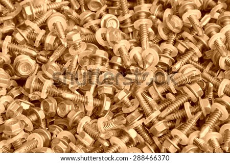 self-tapping screw piled up together, closeup of photo