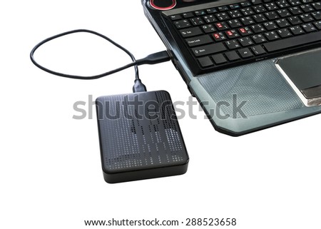 External hard drive connected to laptop on white background with clipping path
