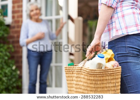Person Doing Shopping For Elderly Neighbor Royalty-Free Stock Photo #288532283